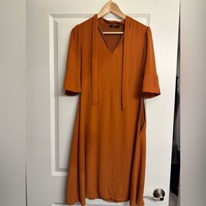 Selling a sheer orange dress